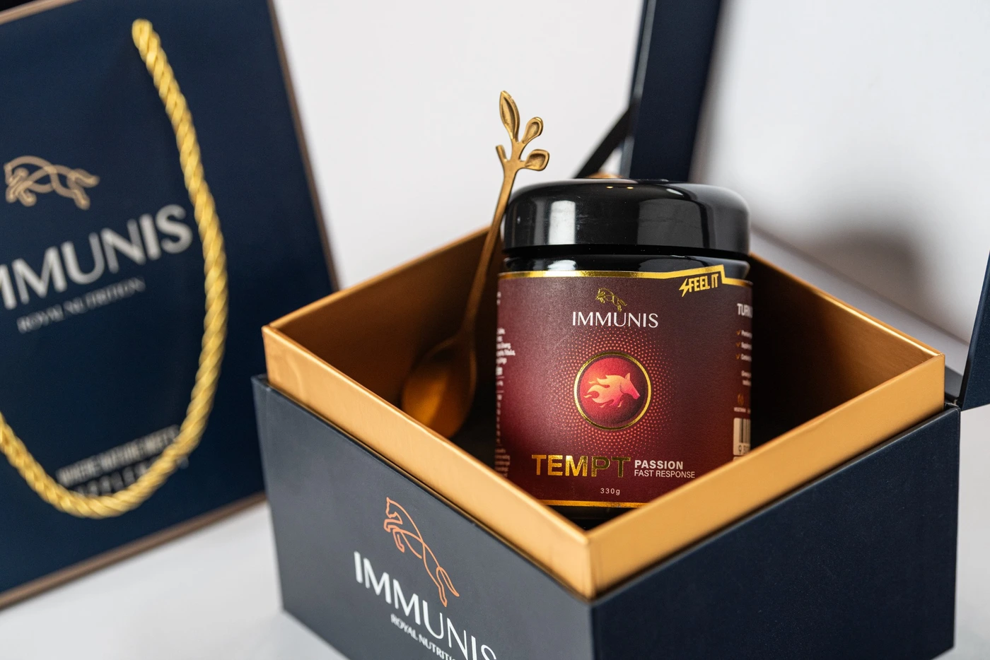 Immunis Tempt in its presentation box with a gold spoon